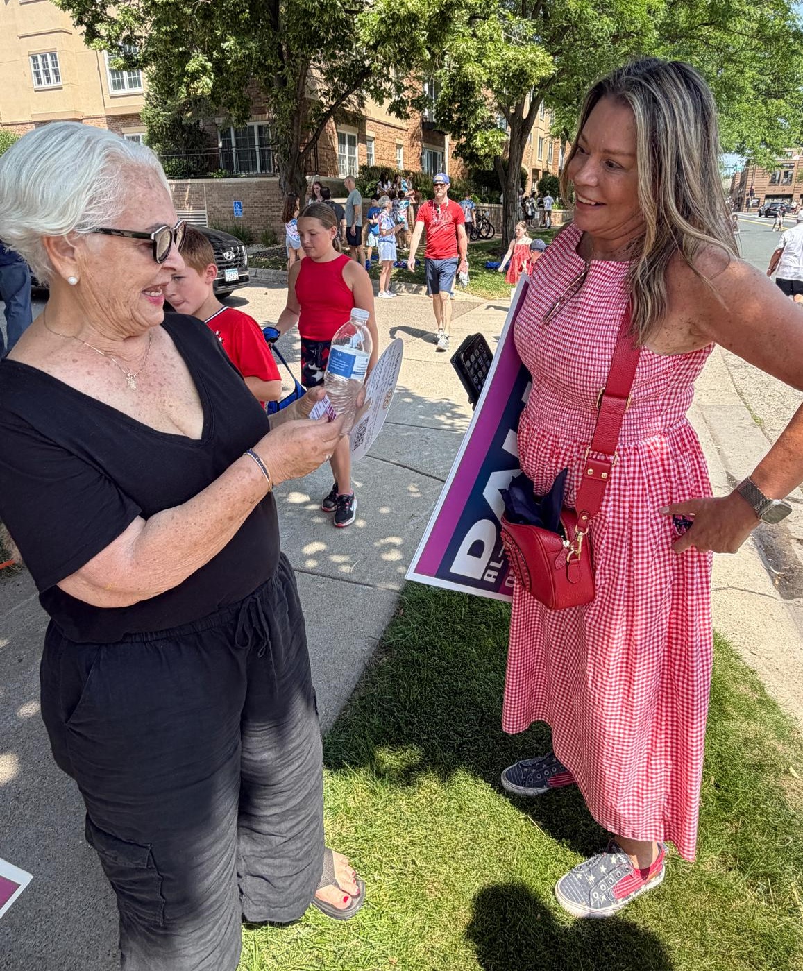 Dalia al-Aqidi at a parade discussing issues